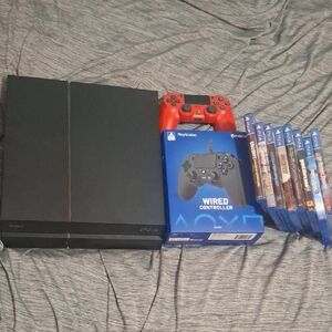 Sony PlayStation Console with Red Controller and Games